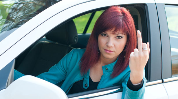 Woman in car showing middle finger via Shutterstock