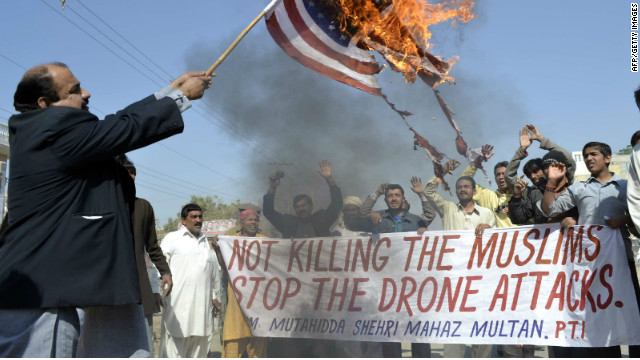A Pakistani man burns an American flag during a protest against U.S. drone attacks in Multan on February 9, 2012.