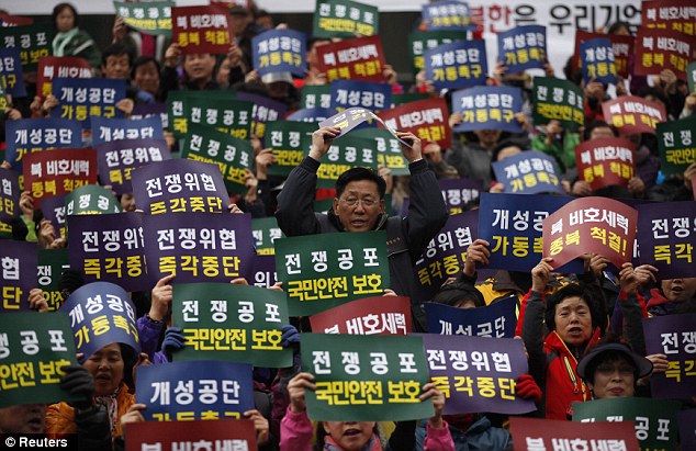 Unrest: Members of the Korea Freedom Federation chant slogans during a rally for North Korea to re-start operations at the joint Kaesong Industrial Complex as the country remained on high alert