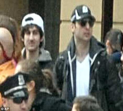 This photo released by the FBI early Friday April 19, 2013, shows what the FBI is calling the suspects together, walking through the crowd in Boston on Monday
