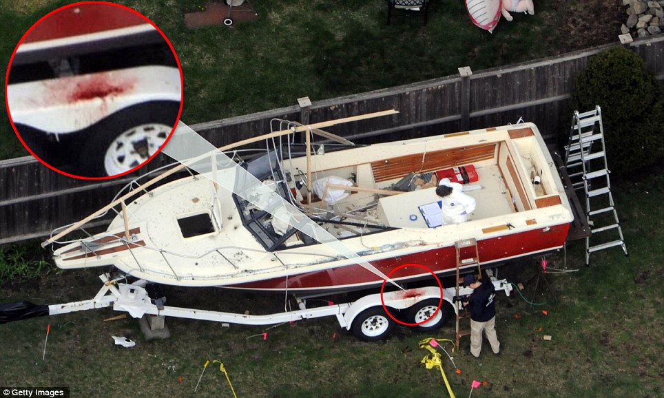 Site: Investigators work around the boat where Dzhokhar Tsarnaev was found hiding after a massive manhunt that left the Boston area paralyzed in fear